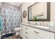 Bathroom featuring dual sinks, modern fixtures, and a decorative shower curtain at 2040 E Indigo Brush Rd, Phoenix, AZ 85048