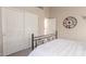 Bedroom featuring a bed with white linens and closet access, offering comfort and functionality at 2040 E Indigo Brush Rd, Phoenix, AZ 85048