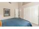 Bright bedroom featuring a modern design, closet space, and a cozy atmosphere at 2040 E Indigo Brush Rd, Phoenix, AZ 85048