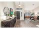 Open entryway featuring wood floors, neutral walls, and a view into the living spaces at 2040 E Indigo Brush Rd, Phoenix, AZ 85048