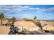 Beautiful single-Gathering house featuring a well-kept lawn, mature trees, and a spacious three-car garage at 2040 E Indigo Brush Rd, Phoenix, AZ 85048
