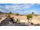 Charming single-Gathering home featuring a well-manicured front yard, mature trees, and a two-car garage at 2040 E Indigo Brush Rd, Phoenix, AZ 85048