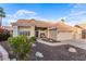 Charming single-story home with a well-manicured yard and inviting curb appeal at 2040 E Indigo Brush Rd, Phoenix, AZ 85048