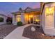 Inviting front porch with cozy seating, desert landscaping, and a stone walkway, creating a welcoming entrance at 2040 E Indigo Brush Rd, Phoenix, AZ 85048