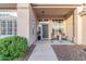 Inviting front porch with seating and decorative plants at the home's entrance at 2040 E Indigo Brush Rd, Phoenix, AZ 85048