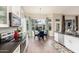 Bright kitchen featuring a breakfast nook with a round table, surrounded by large windows offering natural light at 2040 E Indigo Brush Rd, Phoenix, AZ 85048