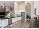 Bright, updated kitchen featuring stainless appliances, white cabinetry, and an island bar at 2040 E Indigo Brush Rd, Phoenix, AZ 85048