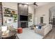 Inviting living room features a modern fireplace, built-in shelving, and comfortable seating at 2040 E Indigo Brush Rd, Phoenix, AZ 85048