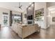 Spacious living room with a stone fireplace, built-in shelves, and plenty of natural light at 2040 E Indigo Brush Rd, Phoenix, AZ 85048