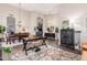 Open living space with dining area, office, and modern furnishings at 2040 E Indigo Brush Rd, Phoenix, AZ 85048