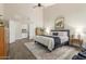 Spacious bedroom with a king bed, an ensuite bath, vaulted ceilings, and a decorative rug at 2040 E Indigo Brush Rd, Phoenix, AZ 85048