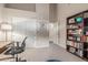 Office featuring a stylish desk, functional chair, and ample storage with a well-stocked bookshelf at 2040 E Indigo Brush Rd, Phoenix, AZ 85048