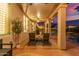 Covered patio featuring comfortable seating, overhead lighting, and scenic backyard views at 2040 E Indigo Brush Rd, Phoenix, AZ 85048