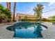 Refreshing pool area complemented by lush landscaping and ambient lighting for nighttime enjoyment and relaxation at 2040 E Indigo Brush Rd, Phoenix, AZ 85048