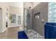 Modern shower with glass enclosure and stylish tile, complemented by bright natural light streaming through nearby windows at 2040 E Indigo Brush Rd, Phoenix, AZ 85048