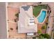 Overhead view of home with pool and patio, solar panels, and yard at 2148 E Cairo Dr, Tempe, AZ 85282