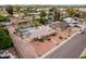Aerial view of home in suburban neighborhood with green grass and trees at 2148 E Cairo Dr, Tempe, AZ 85282