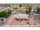 Aerial view of home with a manicured lawn, pool, and solar panels at 2148 E Cairo Dr, Tempe, AZ 85282