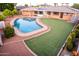 This backyard features a pool, patio, and grass at 2148 E Cairo Dr, Tempe, AZ 85282