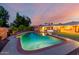 Beautiful backyard with pool and lush landscaping, perfect for outdoor living at 2148 E Cairo Dr, Tempe, AZ 85282