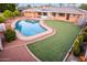 This backyard features a pool, patio, and grass at 2148 E Cairo Dr, Tempe, AZ 85282