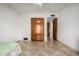 This bedroom features a full closet and ceramic tile flooring at 2148 E Cairo Dr, Tempe, AZ 85282