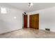 Bedroom featuring a full closet and ceramic tile flooring at 2148 E Cairo Dr, Tempe, AZ 85282