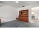 Cozy dining area with a built-in wooden cabinet and a glimpse into the adjacent room at 2148 E Cairo Dr, Tempe, AZ 85282