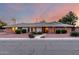 Charming single-story brick home with tidy landscaping, set against a colorful twilight sky at 2148 E Cairo Dr, Tempe, AZ 85282
