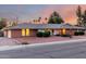 Classic single-story home with a brick facade, a well-kept lawn, and an attached garage at 2148 E Cairo Dr, Tempe, AZ 85282