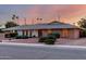 Inviting single-story brick home with a meticulously maintained landscape, perfect for suburban living at 2148 E Cairo Dr, Tempe, AZ 85282