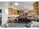Bright eat-in kitchen with light wood cabinetry and a large window at 2148 E Cairo Dr, Tempe, AZ 85282