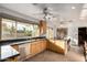 Bright kitchen with granite counters, wood cabinets and a large window overlooking the backyard at 2148 E Cairo Dr, Tempe, AZ 85282