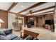 Inviting living room with a wood-paneled accent wall, a brick fireplace, and comfortable seating at 2148 E Cairo Dr, Tempe, AZ 85282