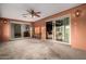 The patio features sliding glass doors and a ceiling fan for comfort at 2148 E Cairo Dr, Tempe, AZ 85282