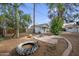 Outdoor space with mature trees, brick patio, storage shed, and seating area at 222 N Miller St, Mesa, AZ 85203