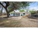 Expansive backyard featuring a brick patio, play structure, and green space at 222 N Miller St, Mesa, AZ 85203