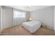 Bright bedroom featuring neutral tones, large window, and ample space for relaxation and personalization at 222 N Miller St, Mesa, AZ 85203
