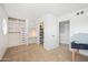 Bedroom with custom closet and built in desk offers efficient storage and a dedicated workspace at 222 N Miller St, Mesa, AZ 85203