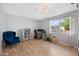 Spacious bedroom with a large window offering natural light and view of yard at 222 N Miller St, Mesa, AZ 85203