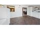 Bright bonus room featuring brick floors and view into dining and kitchen areas and built in storage at 222 N Miller St, Mesa, AZ 85203