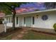 Charming home featuring a quaint front entrance with a colorful door and decorative window detail at 222 N Miller St, Mesa, AZ 85203