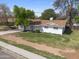 Well-maintained home with a neat front lawn, trimmed bushes, and charming shuttered windows at 222 N Miller St, Mesa, AZ 85203
