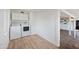 Functional laundry room with a modern washer and dryer and vinyl flooring at 222 N Miller St, Mesa, AZ 85203