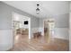 Open-concept living area featuring hardwood floors that connect multiple spaces throughout the home at 222 N Miller St, Mesa, AZ 85203