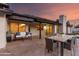 Outdoor patio with a seating area, dining table, and view of the home's exterior and a pool at 226 W Ranch Rd, Tempe, AZ 85284