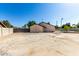 Expansive backyard featuring a large concrete area and partial views of the pool area at 226 W Ranch Rd, Tempe, AZ 85284