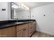 Bright bathroom with a double sink vanity, sleek rectangular mirror, and modern finishes at 226 W Ranch Rd, Tempe, AZ 85284