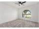 Bright bedroom with a large arch window offering great natural light and neutral carpet at 226 W Ranch Rd, Tempe, AZ 85284