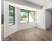 Bright dining room nook with floor-to-ceiling window overlooking backyard pool at 226 W Ranch Rd, Tempe, AZ 85284